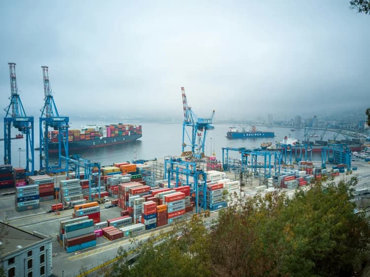 Container port with cranes and stacked shipping containers